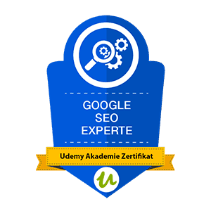 Blaues Abzeichen mit Lupensymbol, Text „Google SEO Experte“ und gelbem Band „Udemy Akademie Zertifikat“.